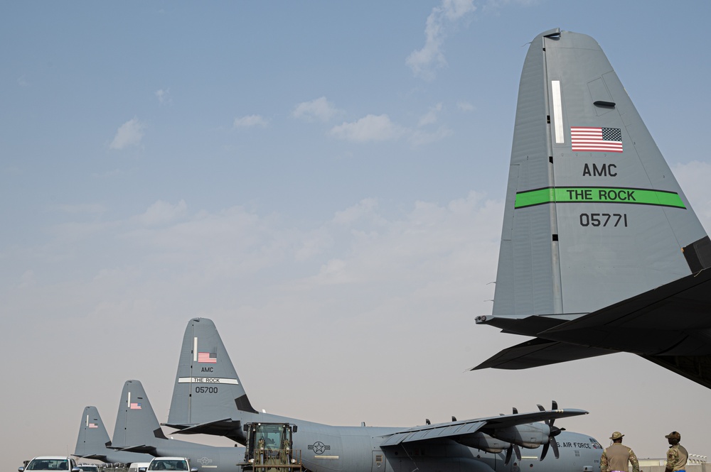 Airmen load AFCENT C-130s with humanitarian aid bound for Gaza