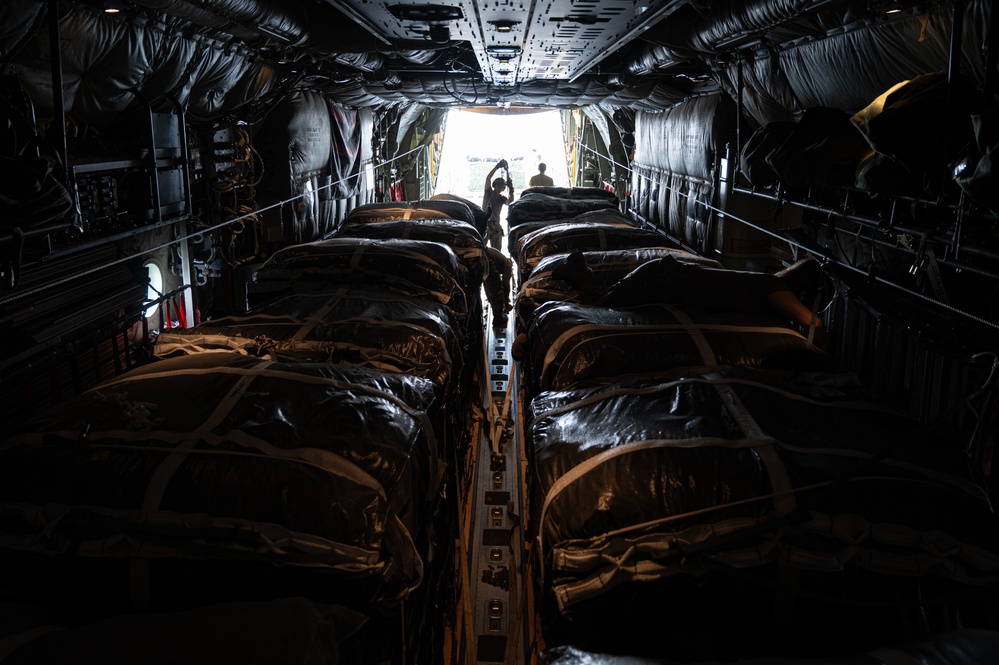 Airmen load AFCENT C-130s with humanitarian aid bound for Gaza