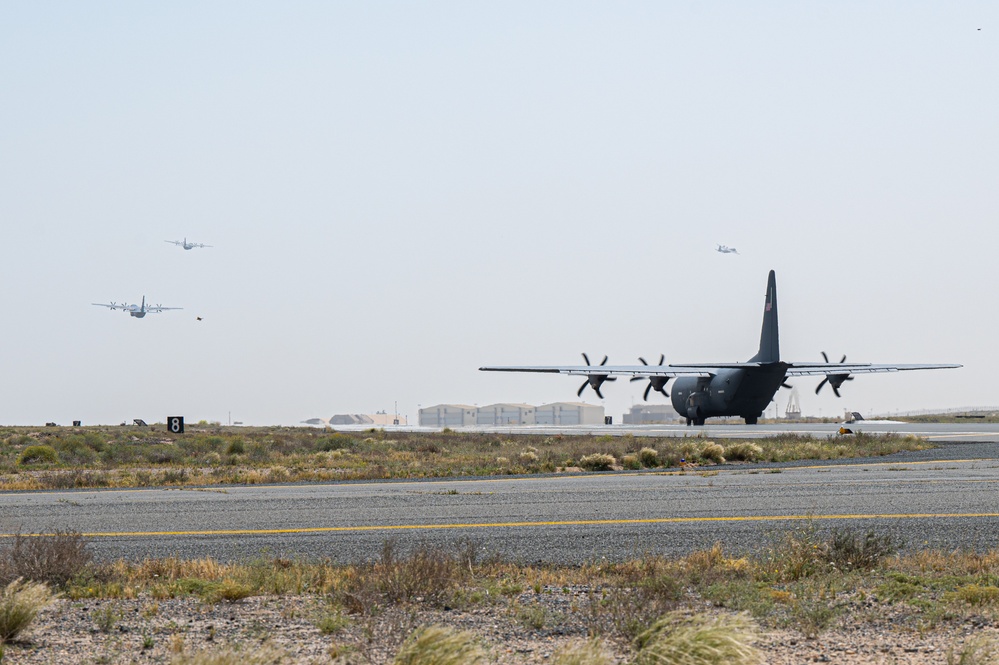 Airmen load AFCENT C-130s with humanitarian aid bound for Gaza