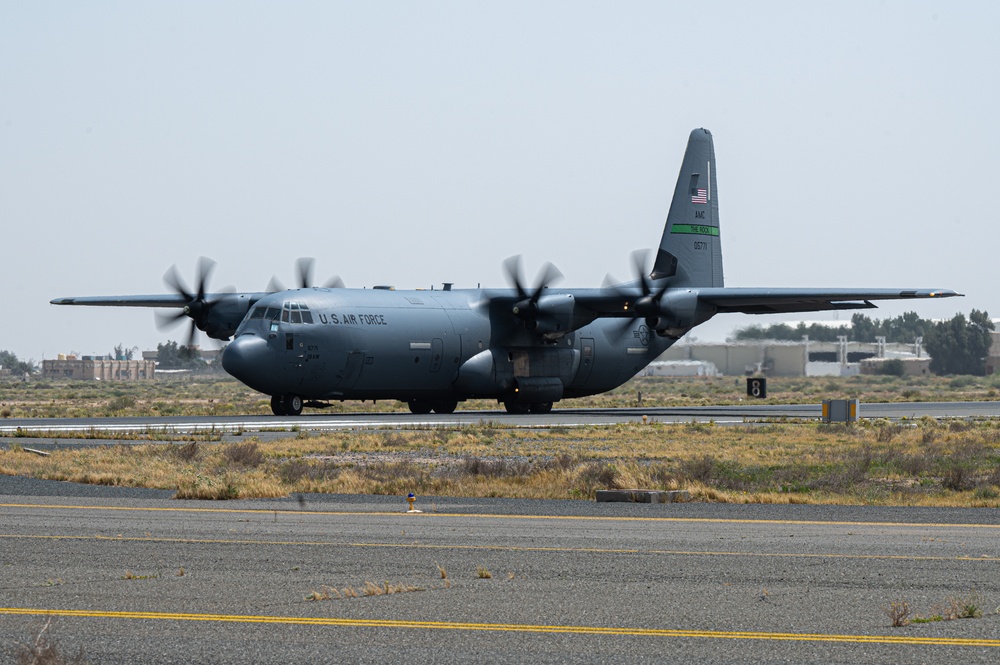 Airmen load AFCENT C-130s with humanitarian aid bound for Gaza