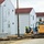 Reset of World War II-era barracks moved in 2023 continues; work nearly complete