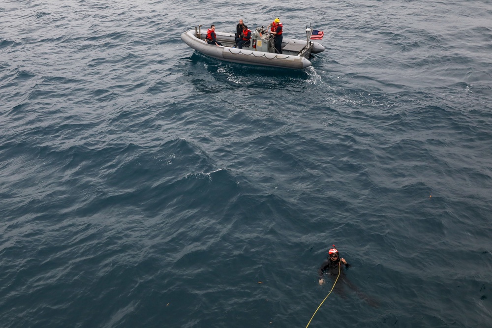 Sailors aboard the USS Howard conduct a search and rescue drill in Okinawa, Japan