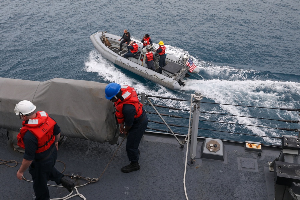 Sailors aboard the USS Howard conduct boat operations in Okinawa, Japan