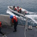 Sailors aboard the USS Howard conduct boat operations in Okinawa, Japan