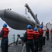 Sailors aboard the USS Howard conduct boat operations in Okinawa, Japan