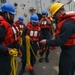 Sailors aboard the USS Howard prepare the heaving lines in Okinawa, Japan