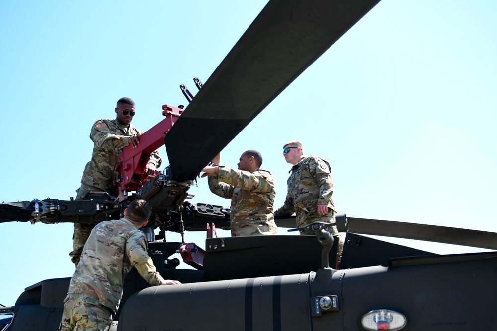 U.S. Army, Air Force team up to load helicopters at Shaw