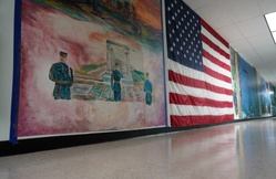 Sailor volunteers to paint murals at the Huntington Hall Naval Berthing Facility [Image 2 of 2]