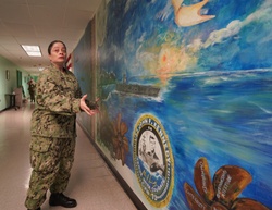 Sailor volunteers to paint murals at the Huntington Hall Naval Berthing Facility [Image 1 of 4]