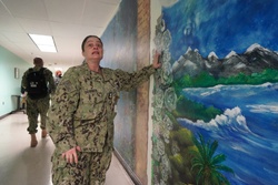 Sailor volunteers to paint murals at the Huntington Hall Naval Berthing Facility [Image 4 of 4]
