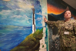 Sailor volunteers to paint murals at the Huntington Hall Naval Berthing Facility [Image 5 of 5]