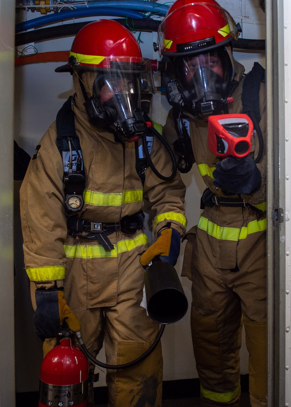 USS Ronald Reagan (CVN 76) Sailors train during a general quarters drill