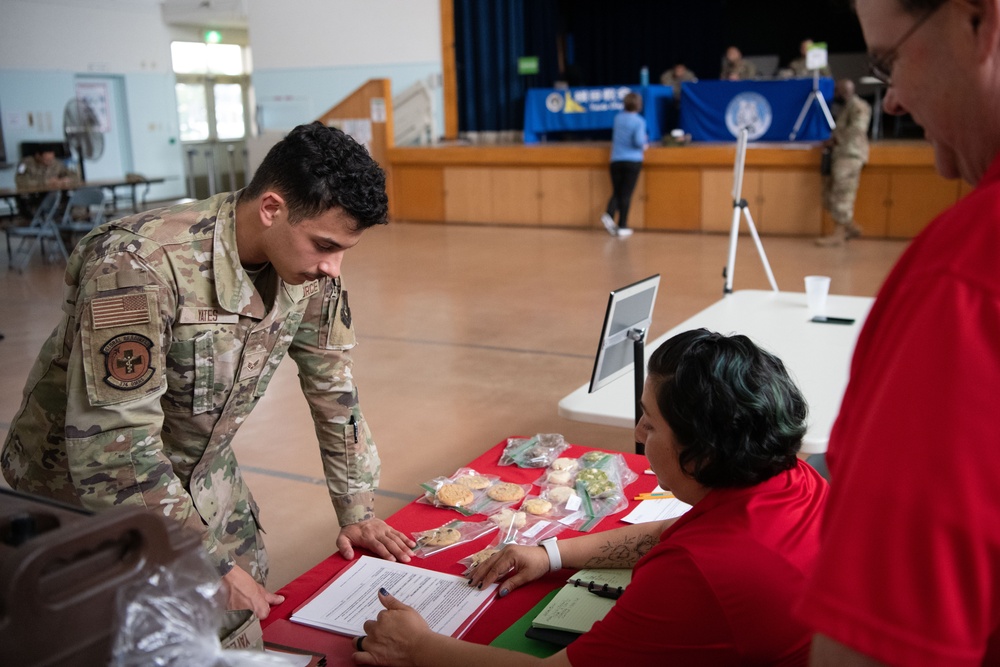 374th Airlift Wing practices emergency evacuation procedures with the base community