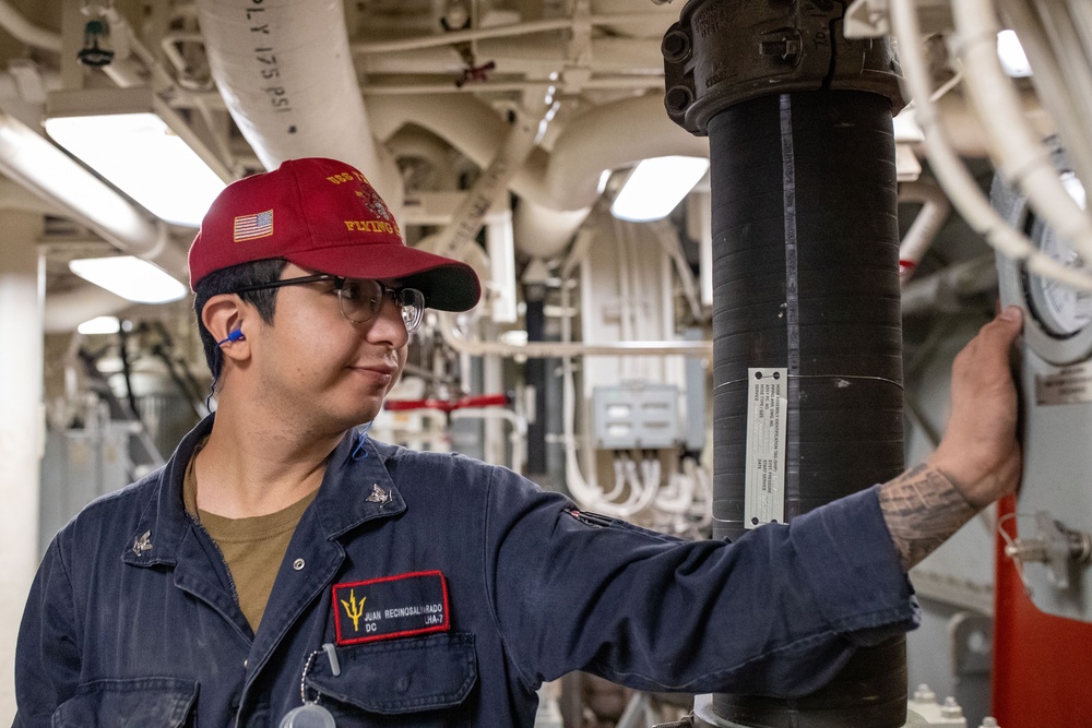 Sailors conduct maintenance aboard USS Tripoli