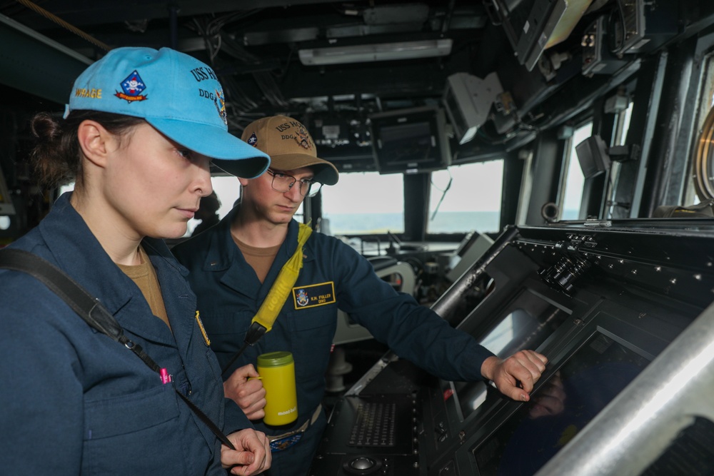 Sailors aboard the USS Howard stand watch in the North Pacific Ocean