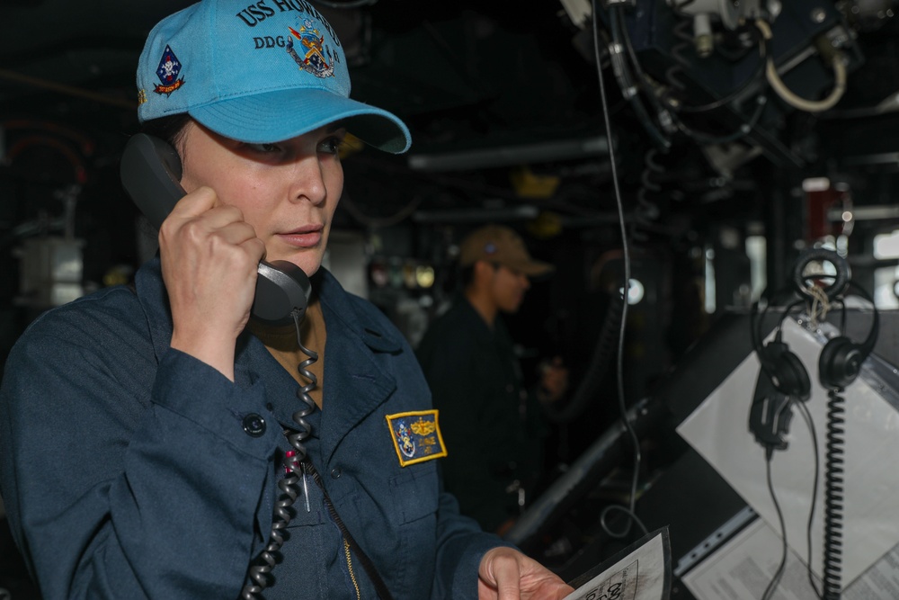 Sailors aboard the USS Howard stand watch in the North Pacific Ocean