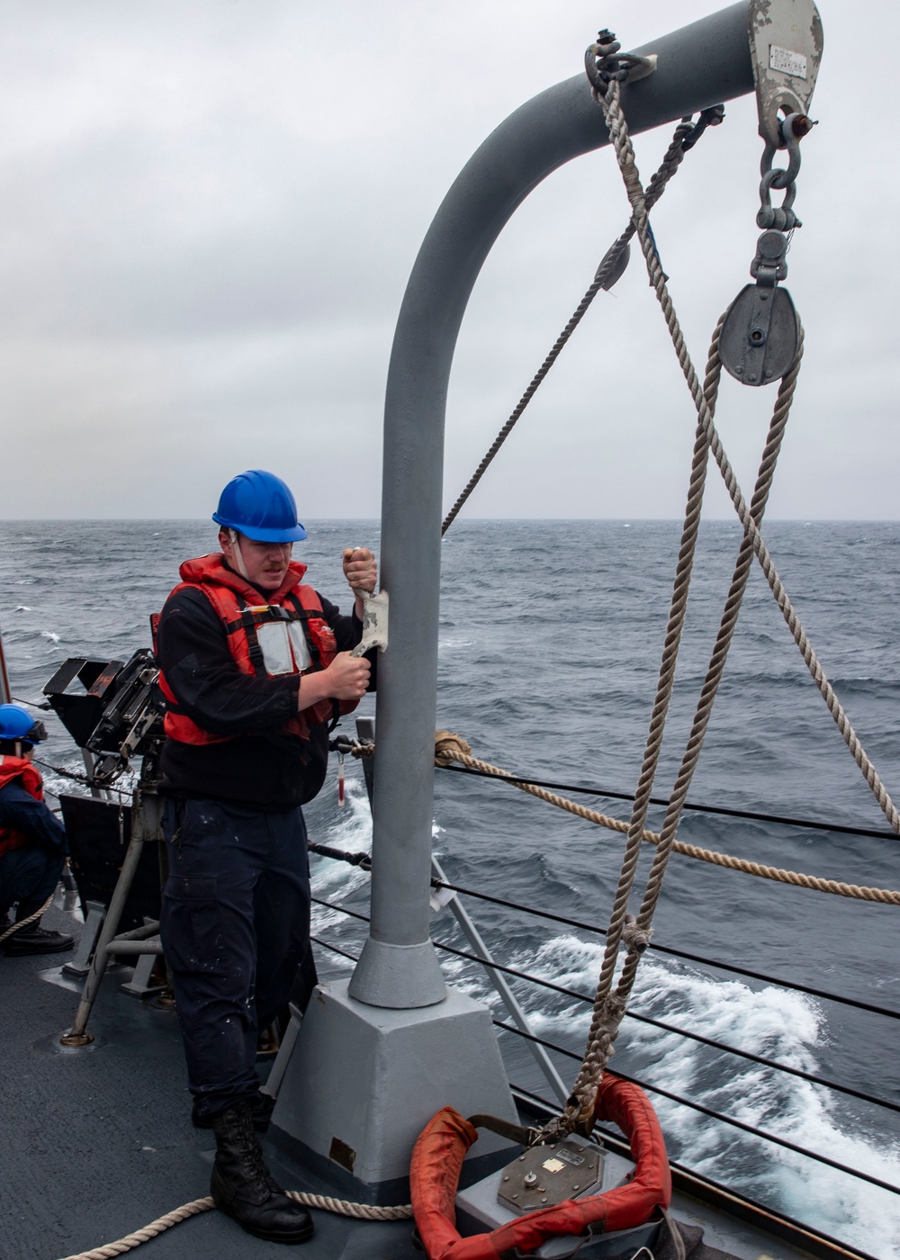 Sailors Conduct a Man Overboard Drill Aboard USS Dewey