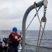 Sailors Conduct a Man Overboard Drill Aboard USS Dewey