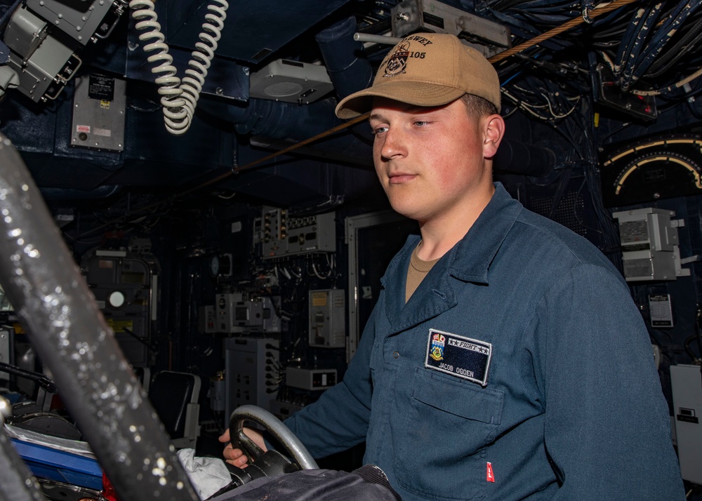Sailors Conduct a Man Overboard Drill Aboard USS Dewey