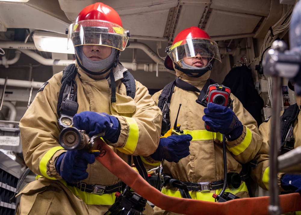 Sailors Conduct a General Quarters Drill Aboard USS Dewey, April 5