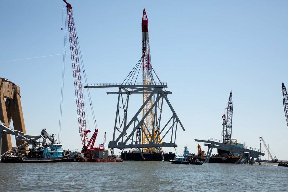 Key Bridge Response 2024 Unified Command salvors move a large piece of supporting steel from the collapsed Francis Scott Key Bridge.