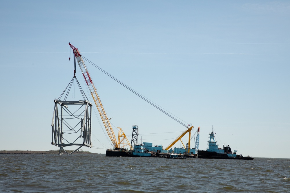 Key Bridge Response 2024 Unified Command salvors move a large piece of supporting steel from the collapsed Francis Scott Key Bridge.