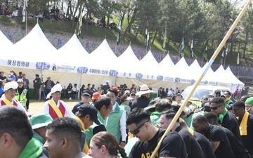U.S. service members participate in the annual Gijisi Tug-of-War Festival