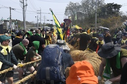 U.S. service members participate in the annual Gijisi Tug-of-War Festival