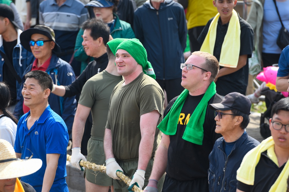 U.S. service members participate in the annual Gijisi Tug-of-War Festival