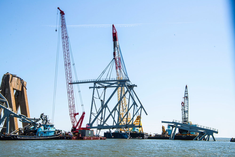 Salvors remove a large portion of bridge blocking the Fort McHenry channel