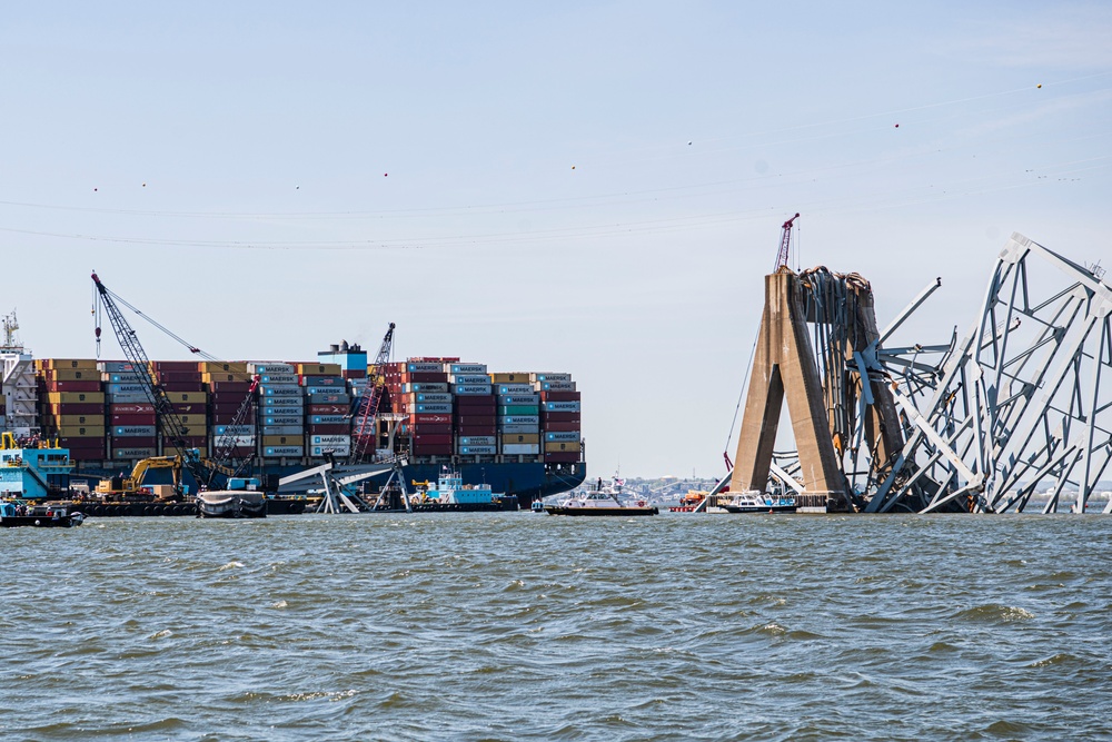 Salvors remove a large portion of bridge blocking the Fort McHenry channel