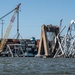 Salvors remove a large portion of bridge blocking the Fort McHenry channel