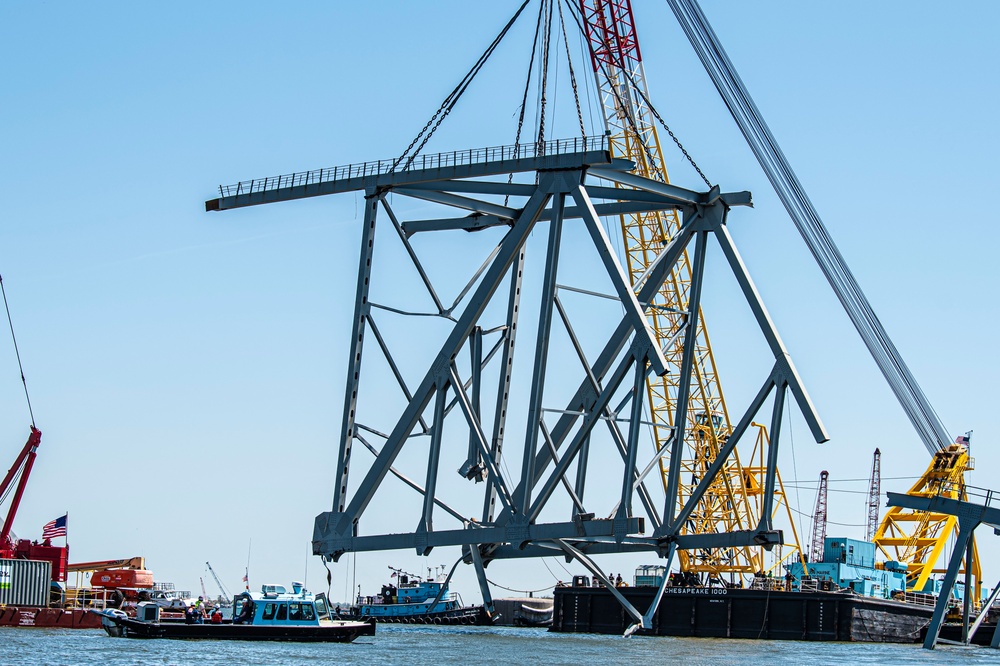 Salvors remove a large portion of bridge blocking the Fort McHenry channel