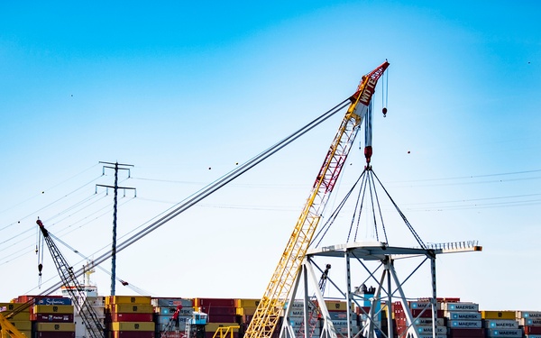 Salvors remove a large portion of bridge blocking the Fort McHenry channel