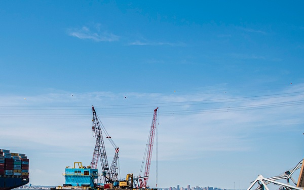 Salvors remove a large portion of bridge blocking the Fort McHenry channel