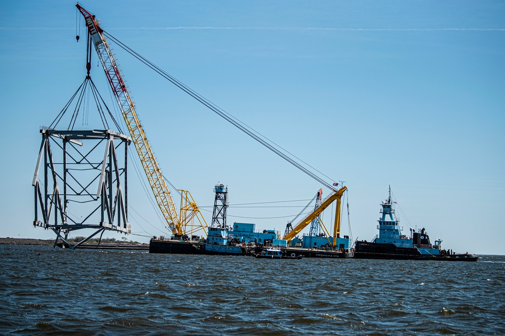 Salvors remove a large portion of bridge blocking the Fort McHenry channel