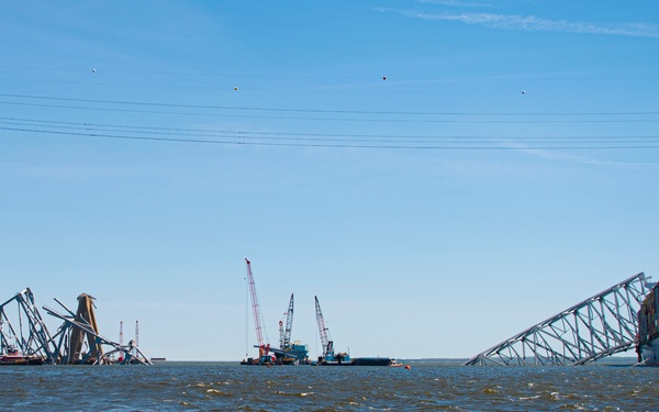 Salvors remove a large portion of bridge blocking the Fort McHenry channel