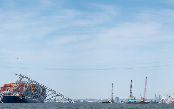Salvors remove a large portion of bridge blocking the Fort McHenry channel