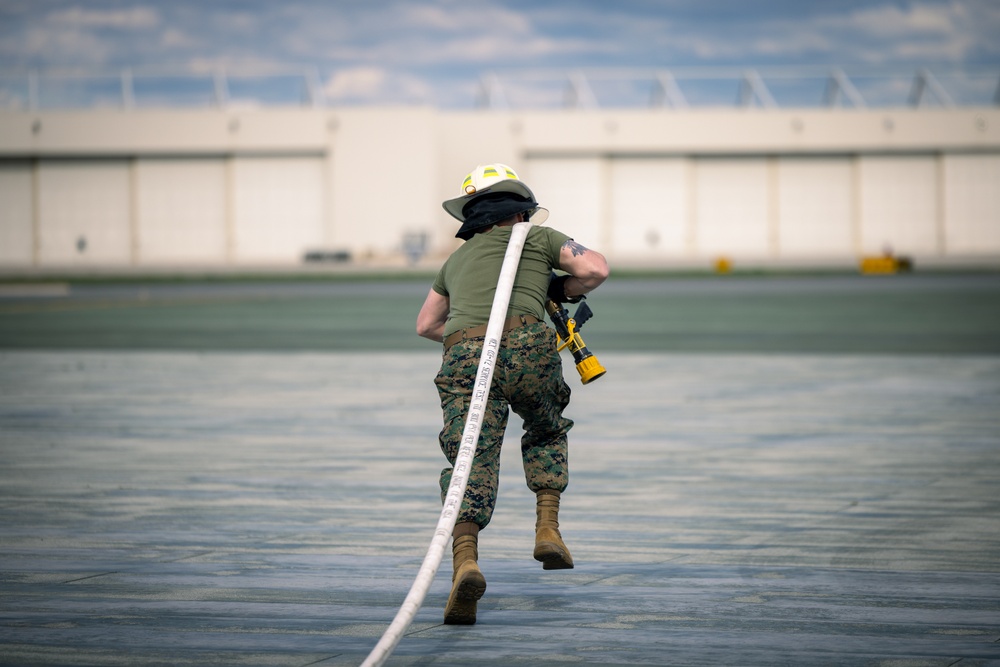 U.S. Marines participate in the Aircraft Rescue and Fire Fighter Rodeo on Marine Corps Base Quantico