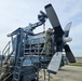 Airmen install propeller on jet engine test stand