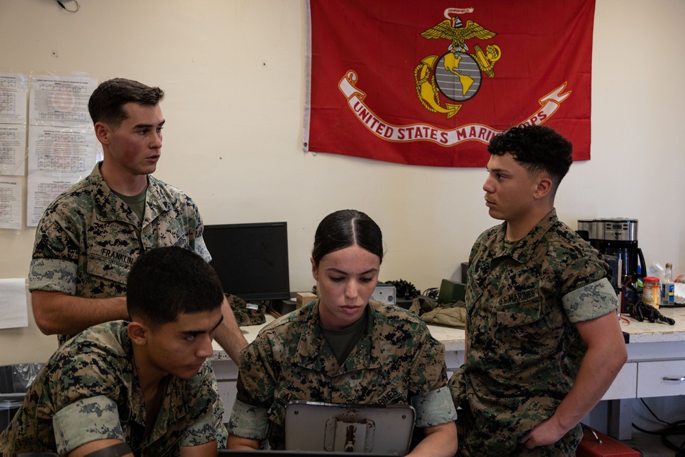 A Marine with 3d Marine Division receives the PFC Herbert A. Littleton Award recognizing his dedication to communications excellence