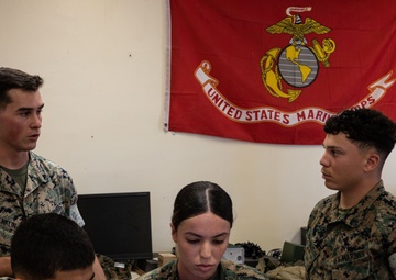 A Marine with 3d Marine Division receives the PFC Herbert A. Littleton Award recognizing his dedication to communications excellence