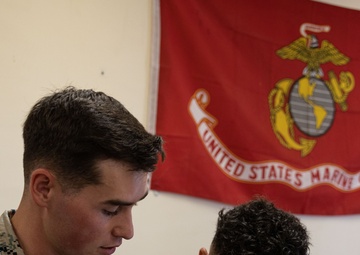 A Marine with 3d Marine Division receives the PFC Herbert A. Littleton Award recognizing his dedication to communications excellence