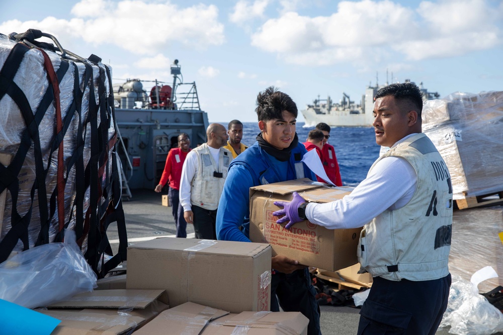 USS Russell (DDG 59) conducts a vertical replenishment with USNS Wally Schirra (T-AKE-8)