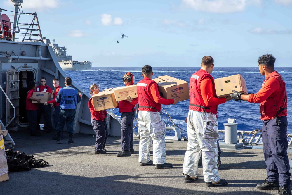 USS Russell (DDG 59) conducts a vertical replenishment with USNS Wally Schirra (T-AKE-8)