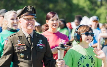 Fort Novosel CG carries torch in Special Olympics