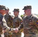 Command Sgt. Maj. James Light Presents the Army Achievement Medal to Best Tank Crew