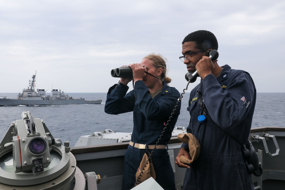 Sailors aboard the USS Howard participate in a trilateral maritime exercise in the East China Sea