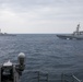 Sailors aboard the USS Howard participate in a trilateral maritime exercise in the East China Sea