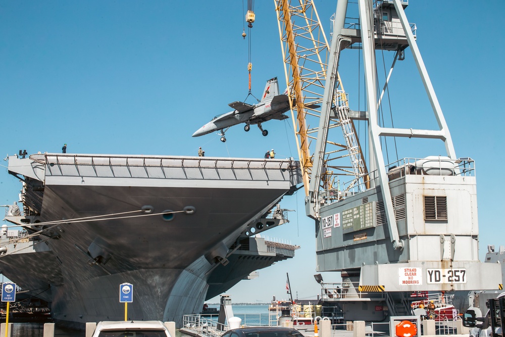 Training Aircraft Lifted Via Crane Aboard Ford